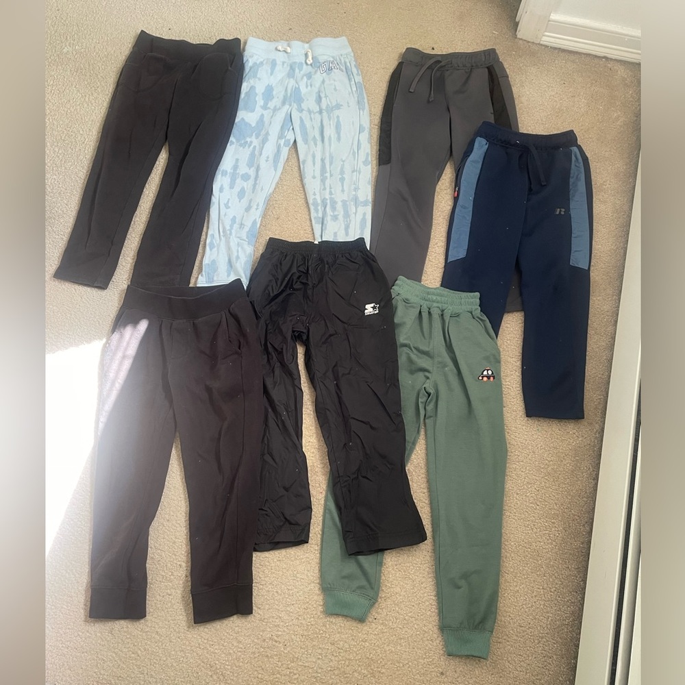 7 pairs of Boys size medium (7-8) gym pants!